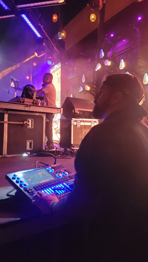 Thomas on set running lighting console